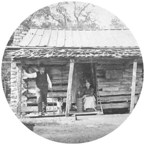 Couple on porch of Log Cabin
